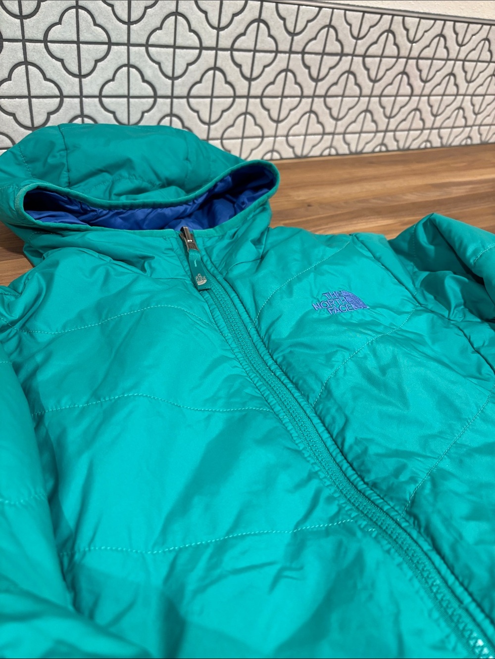 The North Face Teal Hooded reversible Insulated Jacket with Purple Logo